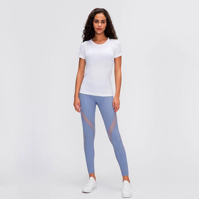 Womens Quick Dry Running Top Short Sleeve For Yoga modeled in white short-sleeve top with breathable fabric for yoga and running