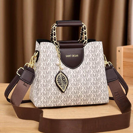 Women's Vintage Printed Bucket Handbag Small Brown compact PU bucket bag with contrast trim, chain handles, leaf charm, nylon-lined interior