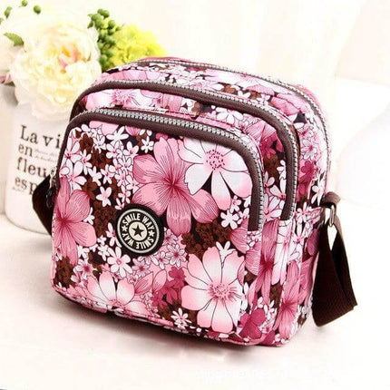 Women's Waterproof Nylon Shoulder Bag For Everyday Use - compact floral pink zipper-closure shoulder bag
