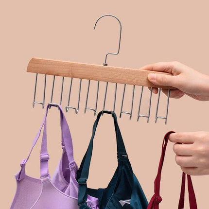 Wooden Sling Hanger for Lingerie with Eight Rotatable Hooks holding bras on wooden frame with metal rotating hooks