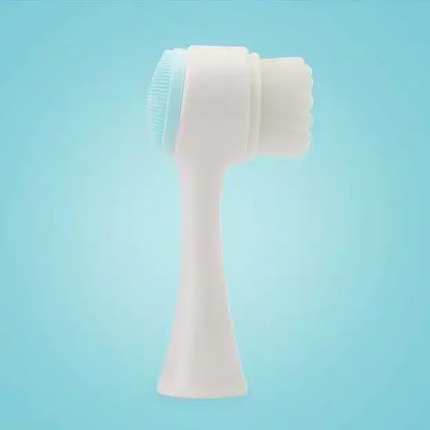 Revitalizing Cleansing Face Wash for Radiant Skin 5 White Facial Cleansing Brush With A Silicone Head And Bristle Attachment On A Blue Background.