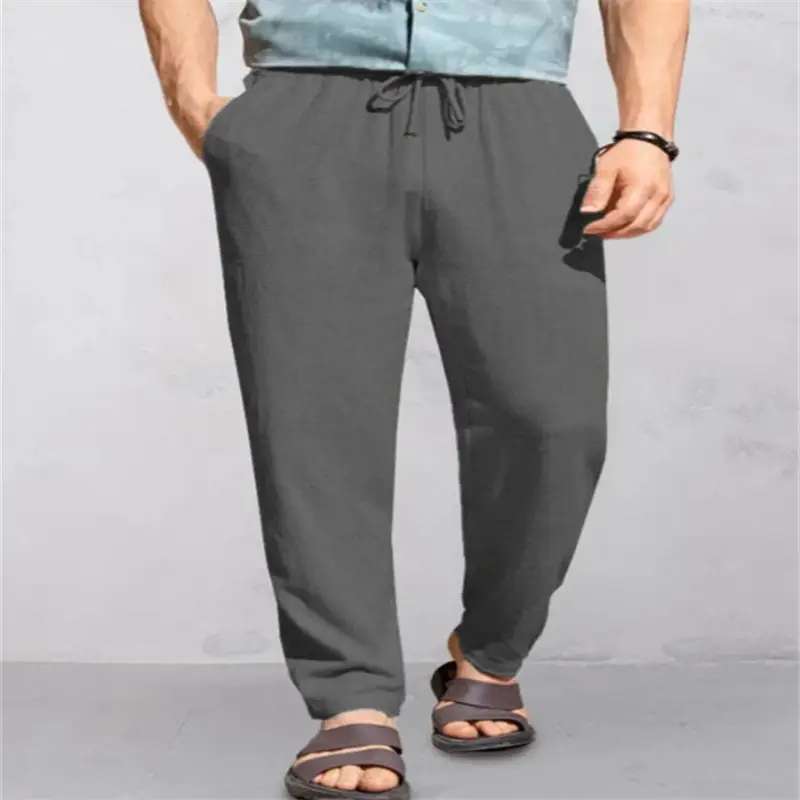 Men's Breathable Linen Outdoor Pants with Drawstring Comfort 9 Man Wearing Gray Drawstring Pants With A Relaxed Fit And Sandals.
