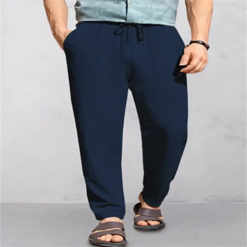 Men's Breathable Linen Outdoor Pants with Drawstring Comfort 7 Man Wearing Navy Blue Casual Pants With A Drawstring And Sandals.