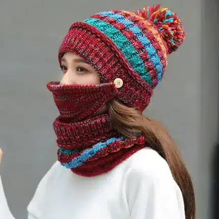 Cozy Korean Winter Knitted Hat for Ultimate Warmth and Style 2 A Woman Wearing A Red Knit Hat With A Pom-Pom And A Matching Scarf That Covers Her Face.