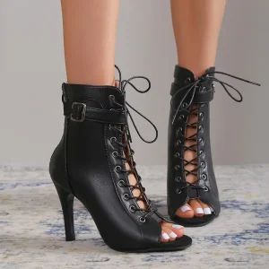 Black open-toe high heeled ankle boots with lace-up design and buckle detail.