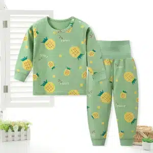 Children's two-piece pajama set featuring a green top with pineapple prints and matching pants.