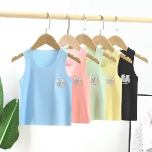 Four sleeveless tops in pastel colors with cartoon animal designs hanging on wooden hangers.