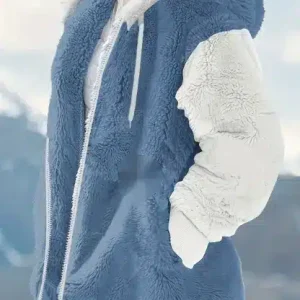 A blue and white fleece jacket with a hood and zip closure worn by a person.