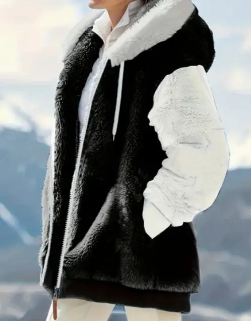 Cozy Women's Winter Jacket for Style and Ultimate Warmth 3 A Black And White Faux Fur Jacket With A Hood And Zip Closure Worn By A Person.
