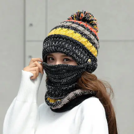 Cozy Korean Winter Knitted Hat for Ultimate Warmth and Style 6 A Person Wearing A Knitted Hat With A Pom-Pom And A Matching Scarf, Both In Black, Yellow, And Grey Colors.
