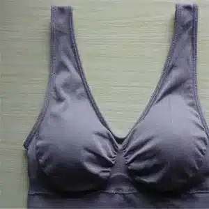 A purple women's bra with a soft fabric and a simple design, featuring a v-neckline and gathered cups.