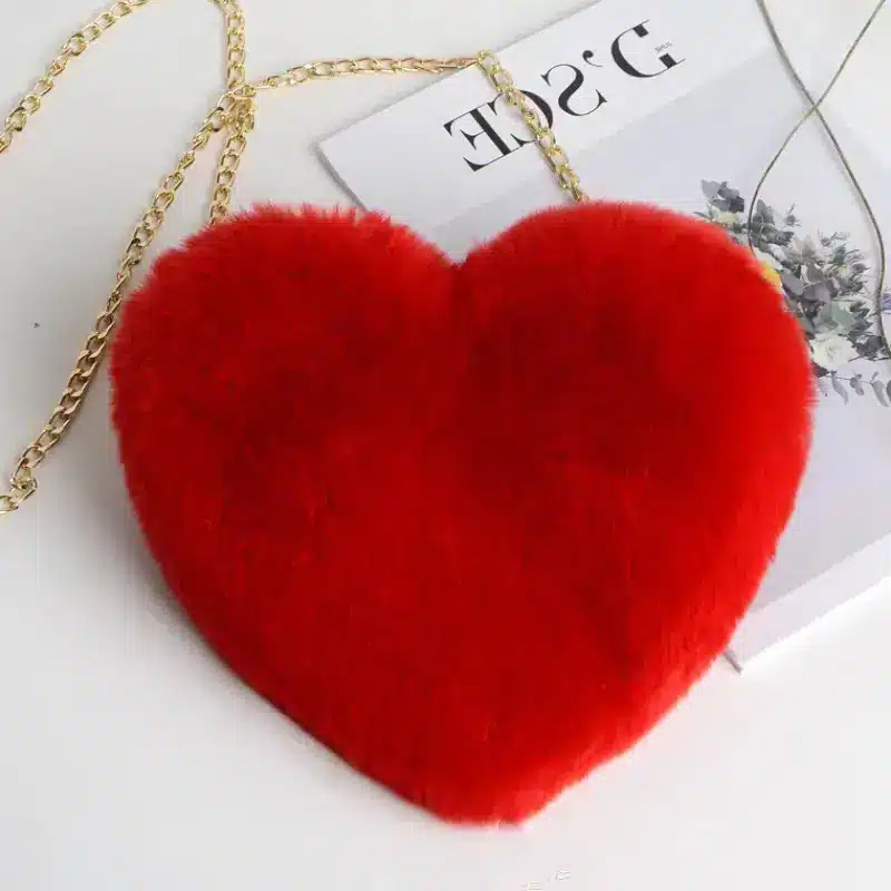 Chic Plush Chain Shoulder Bag for Valentine's Day Delight 5 Red Heart-Shaped Handbag Made Of Fluffy Material With A Gold Chain Strap.