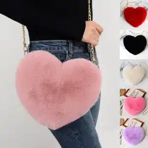Pink heart-shaped crossbody bag made of faux fur with a chain strap.