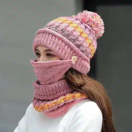 Cozy Korean Winter Knitted Hat for Ultimate Warmth and Style 4 A Woman Wearing A Knitted Pink Hat With A Pom-Pom And A Matching Scarf Covering Her Face.