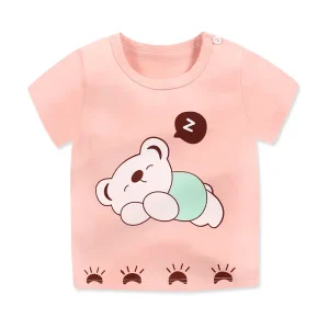 Pink short-sleeve t-shirt featuring a sleeping bear graphic with a speech bubble and sun motifs at the bottom.