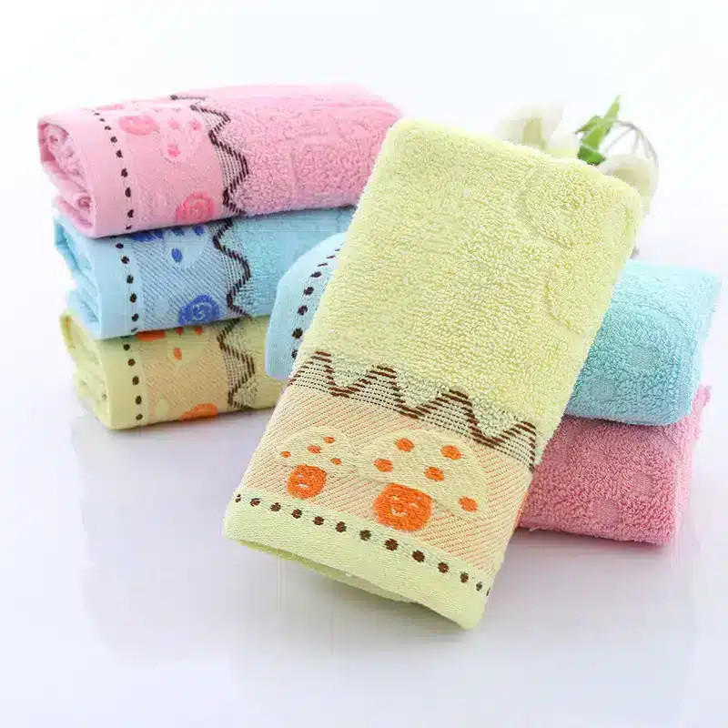 Ultra-Soft Cotton Face Towel for Daily Comfort and Care 8 Stack Of Decorative Towels In Various Colors Including Yellow, Blue, And Pink With Patterned Borders.