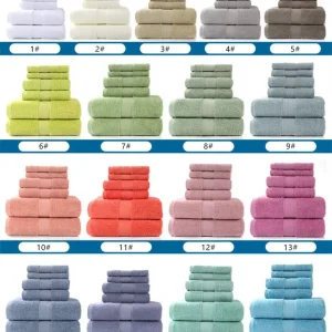 Stacked bath towels in multiple colors including beige, green, pink, and blue arranged in rows.
