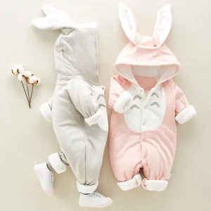 Two bunny-themed baby rompers, one gray and one pink, with hoods and ear details.