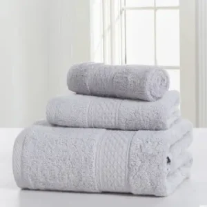 Three gray bath towels stacked on a surface with a textured design.