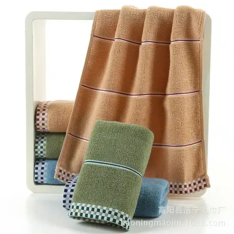 Luxuriously Soft Absorbent Facial Towels for Couples, 2-Pack 7 A Set Of Soft Towels In Brown, Green, And Blue Colors Displayed In Front Of A Mirror.
