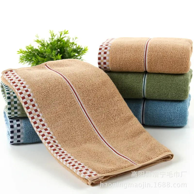 Luxuriously Soft Absorbent Facial Towels for Couples, 2-Pack 2 Four Stacked Bath Towels In Various Colors With Decorative Stripes Along The Edges.