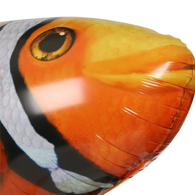 Remote Control Shark Toy - Swim and Fly, Fun for All Ages 3 Close-Up Of An Orange Clownfish Inflatable Toy With Detailed Features.