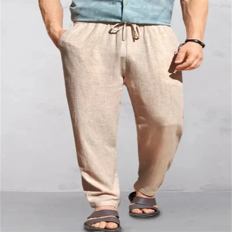 Men's Breathable Linen Outdoor Pants with Drawstring Comfort 4 Beige Casual Pants With A Drawstring Waist, Worn With A Blue Shirt And Sandals.