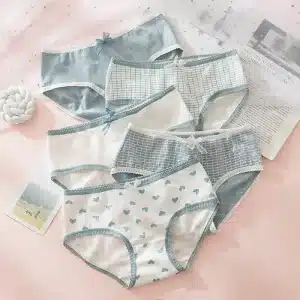Set of six women's underwear in various designs, including patterns of hearts and grid, with lace trim.