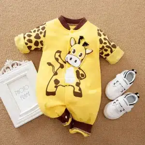 Yellow Baby Romper With Giraffe Print Design And Matching White Shoes.