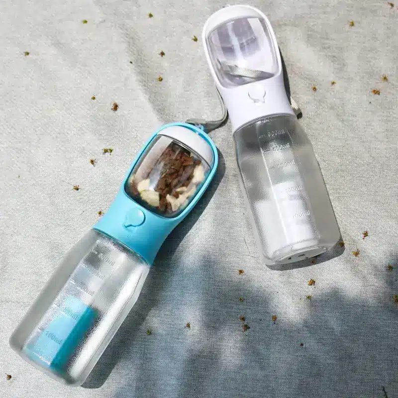 3-in-1 Leak-Proof Travel Bottle & Feeder for Pets 7 Two Water Bottles With Transparent Bodies And Colored Lids, One Blue And One White, Containing Visible Contents.