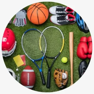 Assorted Sports Equipment Including Balls, Rackets, Gloves, And Shoes Arranged On A Green Surface.