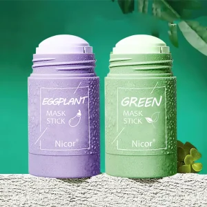 Two Nicor mask sticks, one purple labeled 'Eggplant' and one green labeled 'Green', displayed against a solid background.