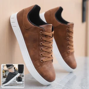 Brown casual sneakers with white soles and brown laces displayed on a neutral background.