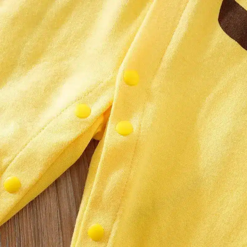 Adorable Baby Jumpsuit Rompers for Easy and Stylish Dressing 5 Close-Up Of A Yellow Baby Onesie Featuring Snap Buttons Along The Side.