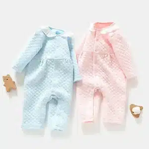 Two Baby Quilted Rompers, One Blue And One Pink, With A Collar And Snap Buttons.