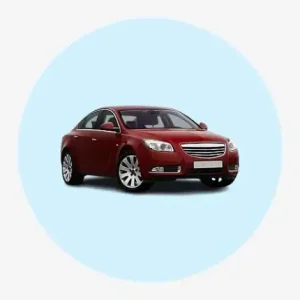 Red Sedan Car With A Sleek Design And Alloy Wheels On A Light Blue Background.