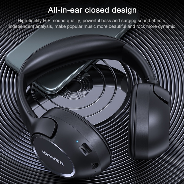 AWEI A770BL Bluetooth 5.0 Wireless Headset - Superior Stereo Sound & Connectivity 12 Wireless Headphones With A Sleek Design Placed On A Textured Surface Next To A Smartphone.