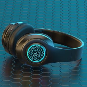 Black over-ear headphones with a blue illuminated design on the ear cups, placed on a hexagonal patterned surface.