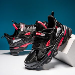 Bright black and pink kids' sneakers with sporty design and adjustable strap for kids, perfect for active footwear, casual wear, and comfortable kids' shoes.