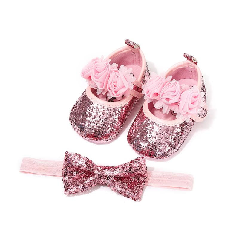 Happy Feet Toddler Baby Shoes - Comfortable and Stylish Pick for Your Little One! 6 Glitter Pink Baby Shoes With Flower Embellishments And Matching Pink Headband With Sequin Bow For Babies And Toddlers. Perfect For Special Occasions Or Photo Shoots.