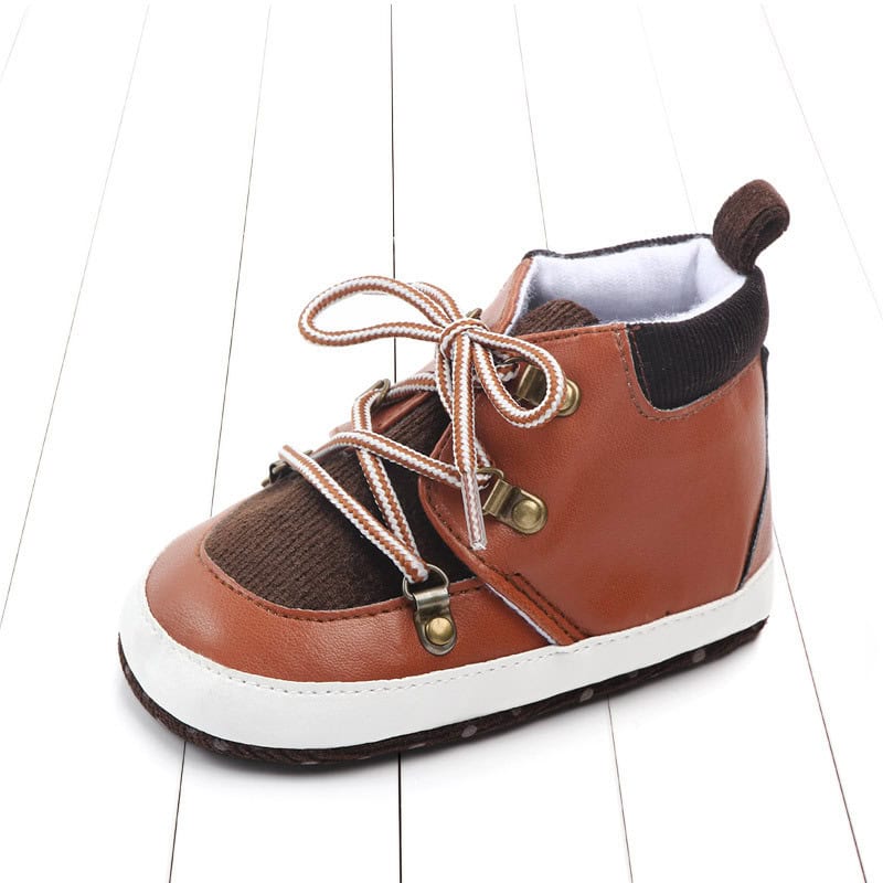 Secure Steps Baby Non-Slip Toddler Shoes - Keep Your Little One Stylish and Safe 1 Leather Kids' Sneakers With Brown And Black Accents, Durable Sole, And Comfortable Design, Perfect For Children’s Casual Wear And Outdoor Activities. Stylish And Functional Footwear For Young Kids.