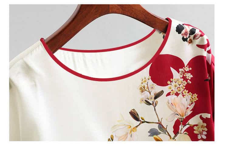 Floral Print Plus Size Silk Satin Bat Sleeve Shirt - Casual Elegance in Plus Sizes 2 Blouse Featuring A Floral Print Design With Red Accents On A Wooden Hanger.