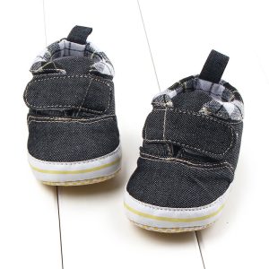 Black and white toddler sneakers with Velcro straps, rubber soles, and plaid inner lining, perfect for kids’ casual wear and active play. Designed for comfort and style for young children.