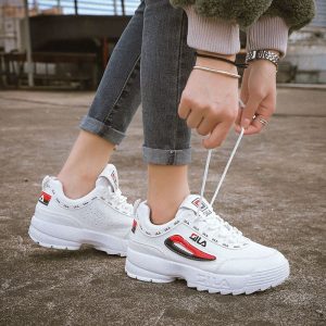 Sneakers, white FILA sports shoes, trendy athletic footwear, casual street style, comfortable sneakers for men and women.
