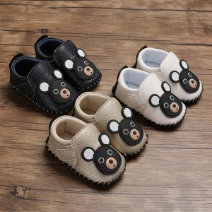 Cute baby shoes with bear face design in black, white, and beige colors, ideal for infants and toddlers, perfect for casual and playful outfits.