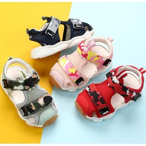 Colorful children's sporty sandals with adjustable straps, camouflage and playful patterns, perfect for active kids and casual outings.
