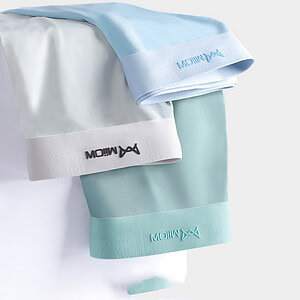 Three swim caps in light blue, gray, and aqua colors with logo on the bands.