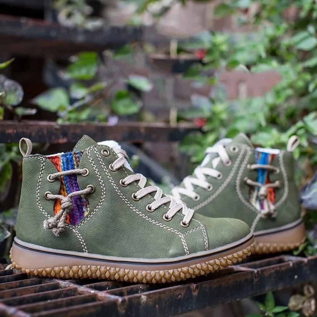 Stay Chic & Warm: Women's Flat Heel Snow Boots - Defeat Winter in Style! 2 Vintage Green High-Top Sneakers With Colorful Striped Accents And Durable Rubber Soles, Perfect For Casual And Outdoor Wear.