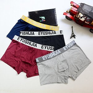 Three pairs of Eyushijia boxer briefs in navy, black, burgundy, and gray with logo waistbands.