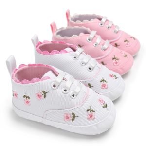 Soft baby sneakers with floral embroidery, ideal for newborns and infants, featuring comfortable fabric, lace-up closure, and adorable pink and white color options. Perfect for casual and everyday wear.